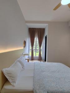 Postel nebo postele na pokoji v ubytování MujiStyle Brinchang Emerald Apartment Cameron 8 guests 2 car park 3bedrooms