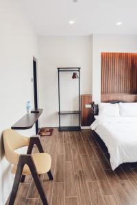 Postel nebo postele na pokoji v ubytování Vĩnh Tuấn Hotel