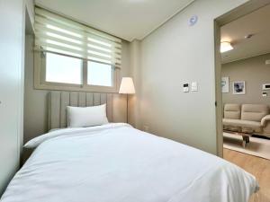 Postelja oz. postelje v sobi nastanitve Eunhasu D&M Residence