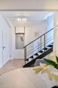 Ένα ή περισσότερα κρεβάτια σε δωμάτιο στο 1 BR Studio - ZENTRAL - TERRASSE - KAFFEE - BUSINESS - WIFI - KÜCHE