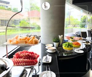 a buffet line with many different types of food at Nine Forty One Hotel in Bangkok