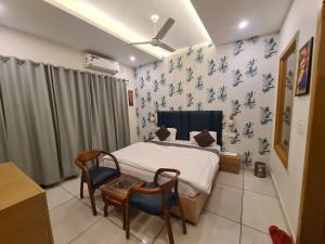 Mahadev Residency客房内的一张或多张床位