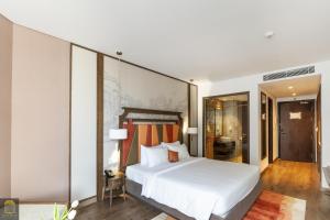 Ein Bett oder Betten in einem Zimmer der Unterkunft Apec Beach Mui Ne Resort