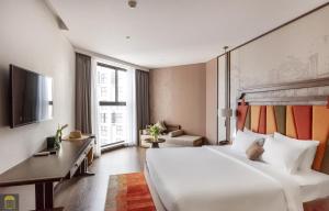 Ein Bett oder Betten in einem Zimmer der Unterkunft Apec Beach Mui Ne Resort