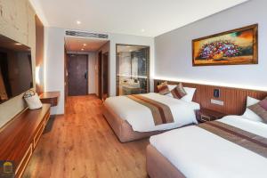Ein Bett oder Betten in einem Zimmer der Unterkunft Apec Beach Mui Ne Resort