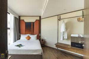 Ein Bett oder Betten in einem Zimmer der Unterkunft Apec Beach Mui Ne Resort