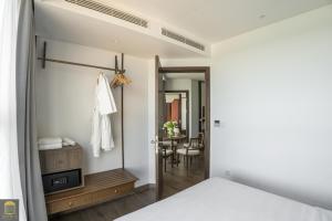 Ein Bett oder Betten in einem Zimmer der Unterkunft Apec Beach Mui Ne Resort