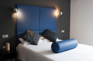 Posteľ alebo postele v izbe v ubytovaní Hostal Totsompops