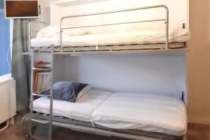 Postel nebo postele na pokoji v ubytování Studio cosy avec balcon et vue sur la montagne à Chamrousse - 19 m²