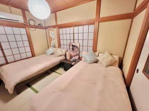 Postel nebo postele na pokoji v ubytování 千住4丁目1階 日本の和のお部屋スカイツリー9分秋葉原10分浅草12分