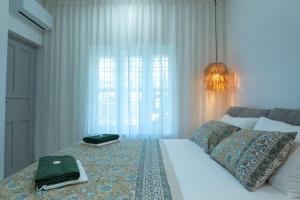 Postel nebo postele na pokoji v ubytování Utopia Varkala - Boutique stay in Odayam rice fields