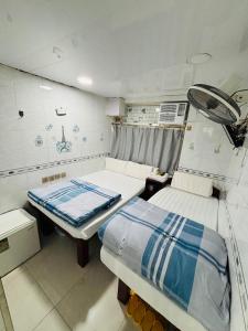 Ένα ή περισσότερα κρεβάτια σε δωμάτιο στο GLOBAL INN RECEPTION FLAT c 4 13 TH FLOOR BLOCK C