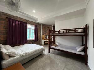 Postel nebo postele na pokoji v ubytování Kundasang Guesthouse + 37 fotografií
