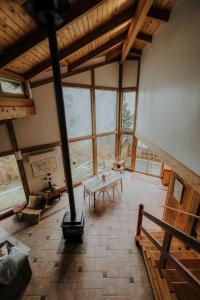 an overhead view of a large living room with windows at First Light - Waterfront, Hot tub, Sauna, EV in Tofino
