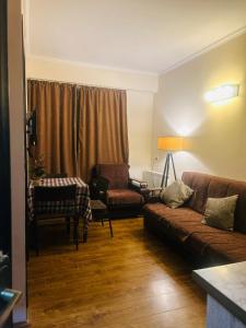 a living room with a couch and a chair at Rest in Bakuriani in Bakuriani