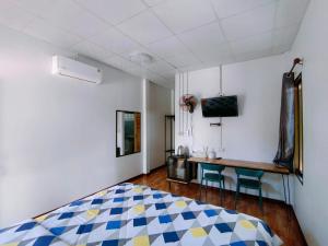 Ένα ή περισσότερα κρεβάτια σε δωμάτιο στο Oonrak Resort อุ่นรักรีสอร์ท ที่พัก อำเภอบ้านผือ จังหวัดอุดรธานี