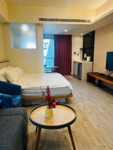 Giường trong phòng chung tại 愛麗徠綜合文旅會館 +12 ảnh