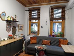 a living room with a couch and a table at NarPera Taksim in Istanbul