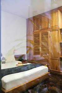 Postel nebo postele na pokoji v ubytování Kim Minh Apartment & Hotel