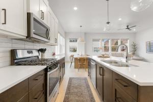 a kitchen with a sink and a stove top oven at Villa #33 at Bloomington Country Club condo in St. George +48 photos