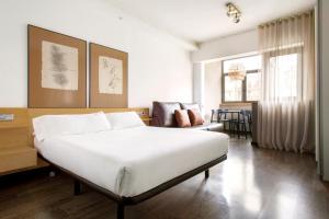 Posteľ alebo postele v izbe v ubytovaní Barcelona Apartment Aramunt
