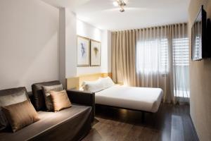 Posteľ alebo postele v izbe v ubytovaní Barcelona Apartment Aramunt