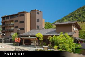 an exterior view of a building in front of a building at Yamanaka Onsen Kagari Kisshotei in Kaga