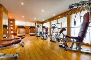 a gym with several treadmills and cardio machines at Hyatt Regency Nice Palais de la Méditerranée in Nice
