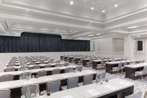 a large room with rows of tables and chairs at Hyatt Regency Nice Palais de la Méditerranée in Nice