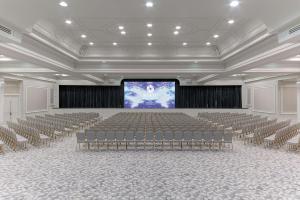 a large room with chairs and a projection screen at Hyatt Regency Nice Palais de la Méditerranée in Nice