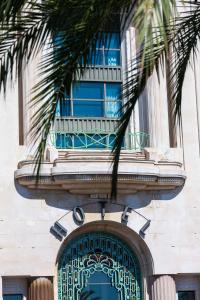 a building with a balcony over a door with a window at Hyatt Regency Nice Palais de la Méditerranée in Nice