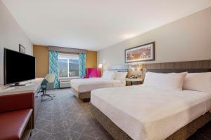 Voodi või voodid majutusasutuse Hilton Garden Inn Colorado Springs Airport toas