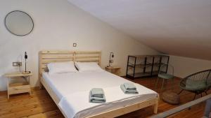 a bedroom with a large bed with towels on it at Sunrise Studio 2 Afitos in Afitos +16 photos