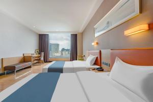 Voodi või voodid majutusasutuse Yunli Boutique Hotel toas