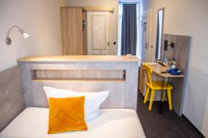 Postel nebo postele na pokoji v ubytování Hotel-Restaurant Steuermann