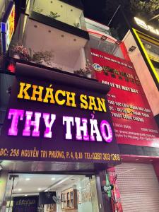 a sign on a building that readshash san try trio at Khách sạn Thy Thảo in Ho Chi Minh City