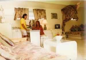 a man and a woman standing in a living room at The Legend Garden Condos in Saint Peter