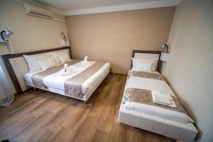 Postel nebo postele na pokoji v ubytování Hotel Zenubia