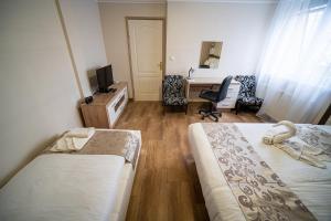 Postel nebo postele na pokoji v ubytování Hotel Zenubia