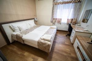 Postel nebo postele na pokoji v ubytování Hotel Zenubia