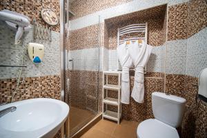 Koupelna v ubytování Hotel Zenubia + 25 fotografií