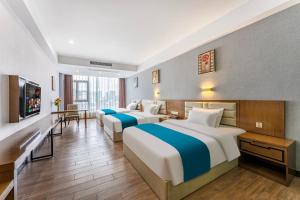 Voodi või voodid majutusasutuse Yunli Boutique Hotel toas