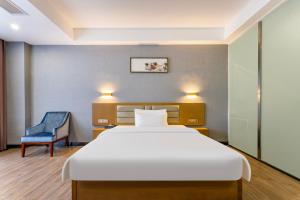 Voodi või voodid majutusasutuse Yunli Boutique Hotel toas