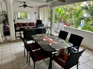 a dining room table and chairs in a living room at Casa Mara Beachfront Villa - Pool & Sunset Views in Sayulita