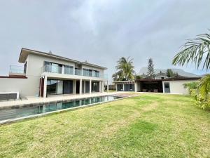 an image of a house with a swimming pool at Coral Residence Luxury Villa in Vieux Grand Port