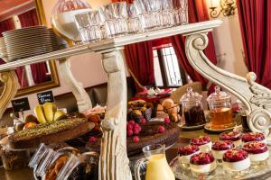 a buffet of desserts and pastries on a table at Le Cavendish in Cannes