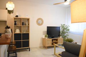 Televízia a/alebo spoločenská miestnosť v ubytovaní Precioso apartamento en el centro de Málaga