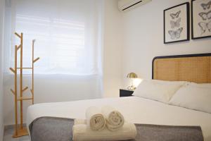 Posteľ alebo postele v izbe v ubytovaní Precioso apartamento en el centro de Málaga