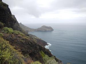 a view of the ocean from a mountain at Albergue Montes de Anaga in El Bailadero