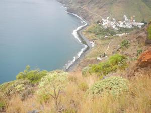 a view of the ocean from a hill at Albergue Montes de Anaga in El Bailadero